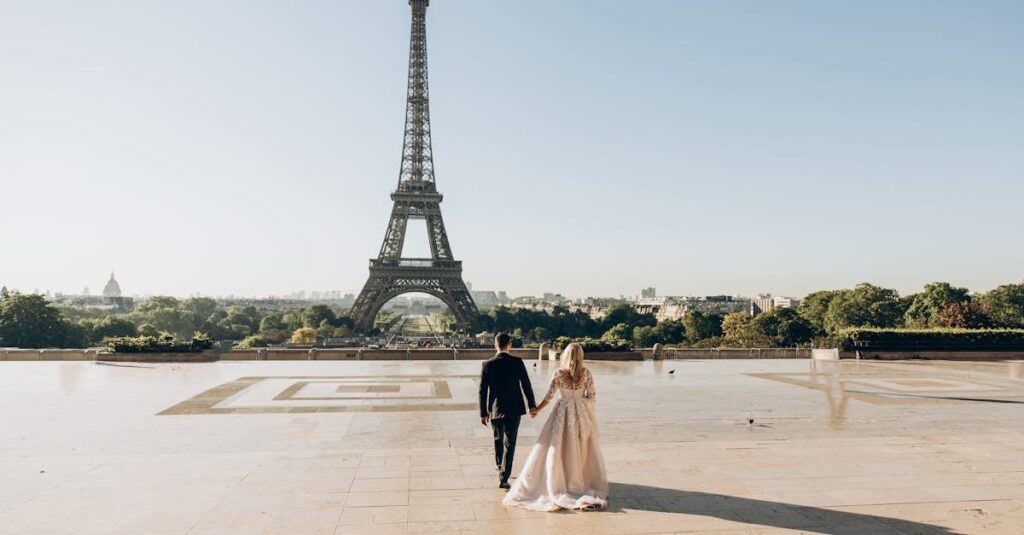 Woman and Man Walking in Park in Front of Eiffel Tower